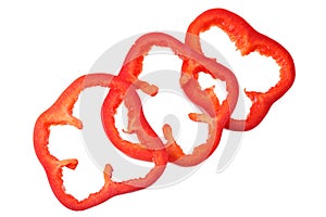 cut slices of red sweet bell pepper isolated on white background. top view