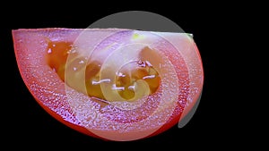 Cut Tomato Isolated on Black Background