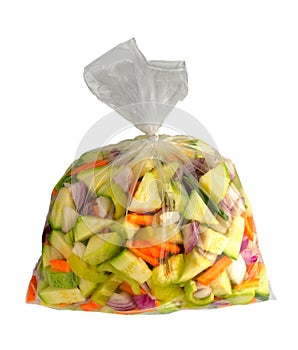 Cut vegetables ready for cooking sealed plastic bag isolated. Pa
