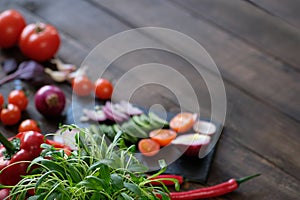 Cut vegetables for salad on a wooden board