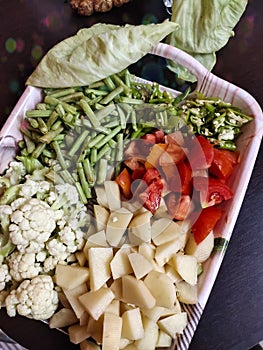 Cut vegetables on tray beans, tomato, potato,cauliflower
