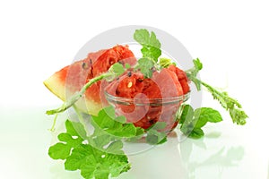 Cut watermelon fruit and leaves photo