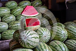 Cut watermelon sits out at a market stand in the Crawford Market of Mumbai