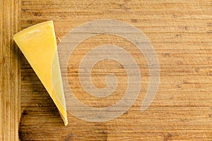 Cut wedge of fresh Dutch Maasdam cheese
