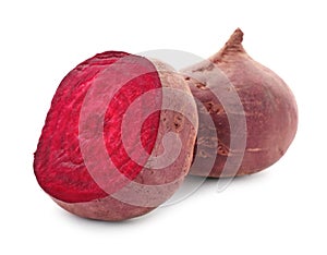 Cut and whole beets on white background