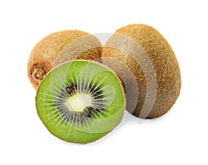 Cut and whole fresh kiwis on background