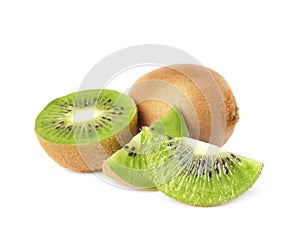 Cut and whole fresh kiwis on white background