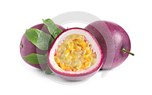 Cut and whole passion fruits with leaf isolated on white