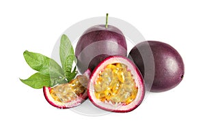 Cut and whole passion fruits with leaf isolated on white