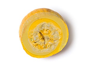 Cut yellow pumpkin on a white background. Studio photography
