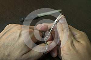 Cut your fingernails with small nail scissors,