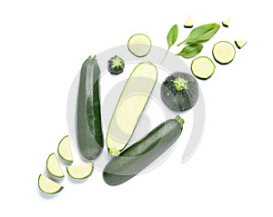 Cut zucchini squashes on white background