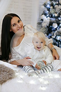 Cute 1 year old baby boy and his beautiful mother posing in New