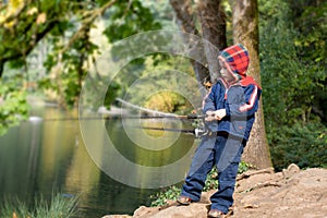 Cute 4 years old fisher boy