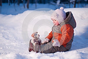 Cute adorable baby sit on snow