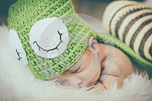 Cute and adorable newborn baby with costume sleeping