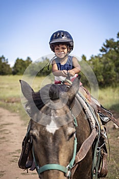 Cute African American Boy on his first horse ride