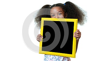 Cute african american girl holding a blank blackboard with space for text