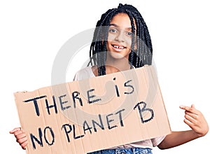 Cute african american girl holding there is no planet b banner smiling happy pointing with hand and finger