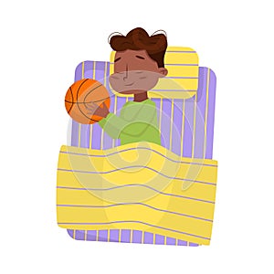 Cute African American Little Boy Sleeping Sweetly in his Bed with Basketball Ball, Bedtime, Sweet Dreams of Adorable Kid