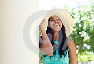 Cute african american woman smiling with sun hat