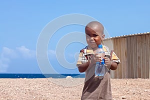 Cute African Child with Water Bottle Drink