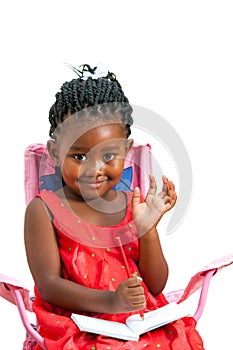 Cute african girl with note book waving hand.