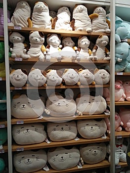 Cute animal dolls/toys on orderly store shelves