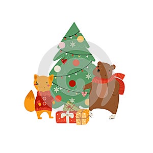 Cute animals near Christmas tree