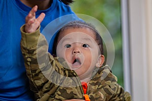 Cute Asian Baby boy with camouflage jacket