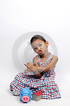 Cute Asian baby girl portrait sitting and house model, piggy bank for saving money on white backgrounds