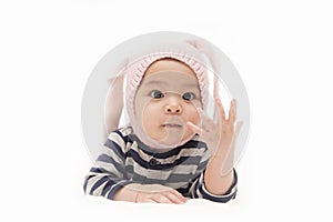 Cute Asian baby girl with rabbit hat showing her fingers on white background