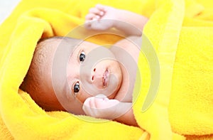 Cute asian baby with yellow towel