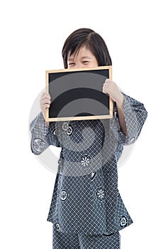 Cute asian boy holding black board on white background