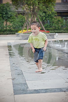 Cute asian boy in park