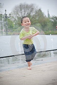 Cute asian boy in park