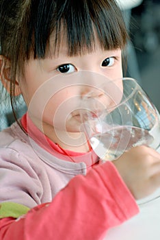 Cute Asian child Drink water