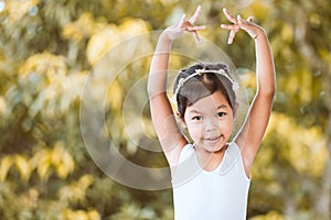 Cute asian child girl is practicing a ballet