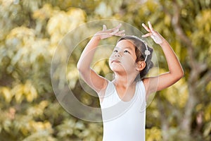 Cute asian child girl is practicing a ballet