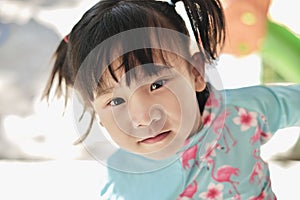 Cute Asian child girl is smiling happily