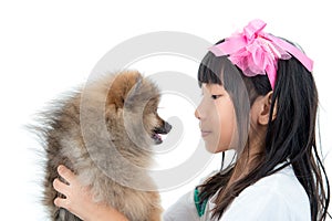 Cute Asian child with her happy doggy