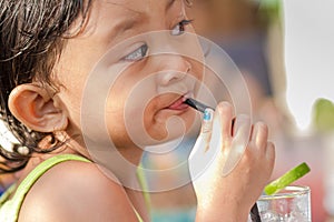 Cute Asian Child Thirsty Drinking Iced Lemonade