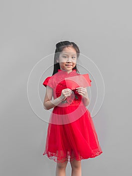 Cute Asian girl in chinese cheongsam and Tradition Chinese dress with red envelope , Chinese new year concept