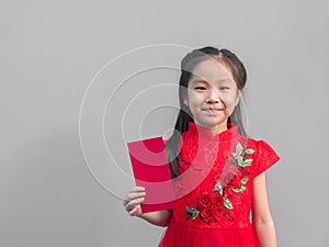 Cute Asian girl in chinese cheongsam and Tradition Chinese dress with red envelope , Chinese new year concept