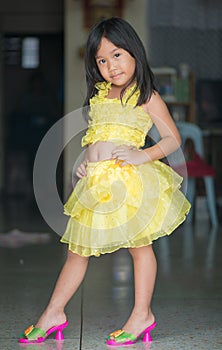 Cute asian girl in dance costume having fun