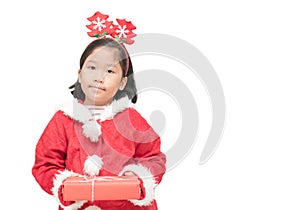 Cute asian girl in santa claus suit holding gift box