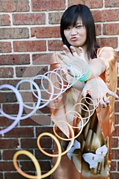 Cute Asian girl with slinky toys