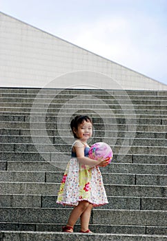 Cute Asian girl on steps