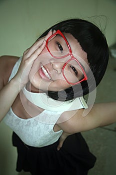 Cute Asian girl wearing glasses