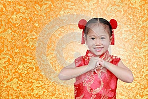 Cute asian kid girl in Traditional Chinese dress on Chinese seamless pattern, Chinese new year concept